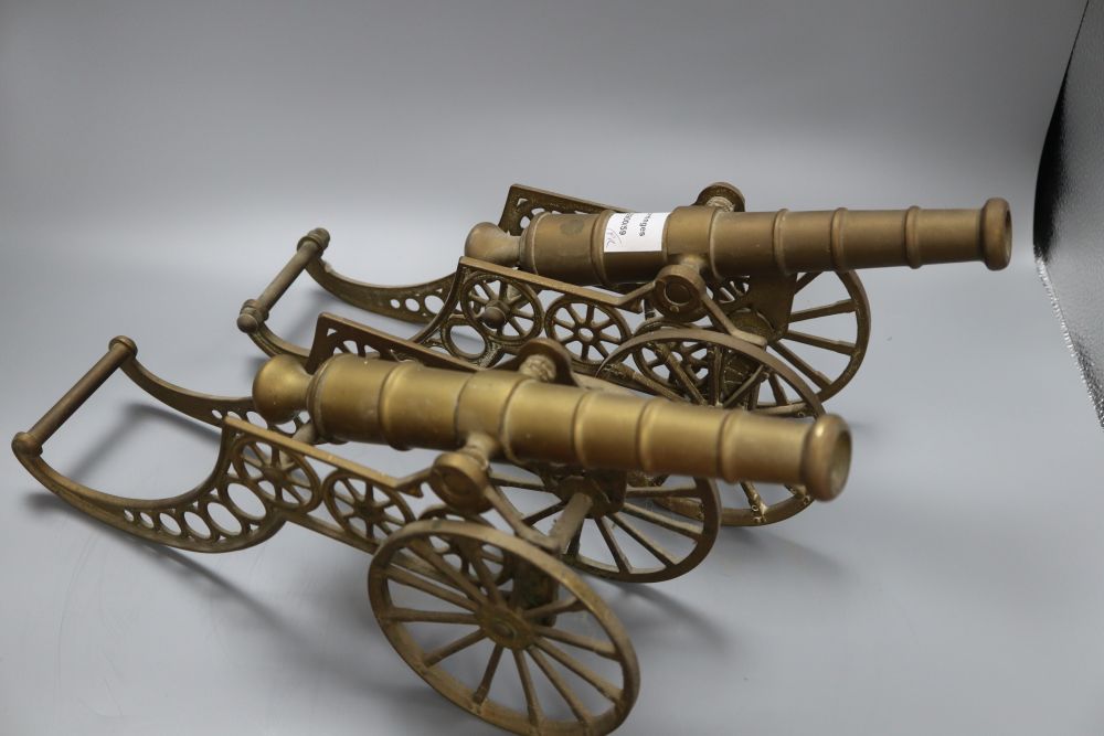 A pair of brass models of cannons, length 44cm